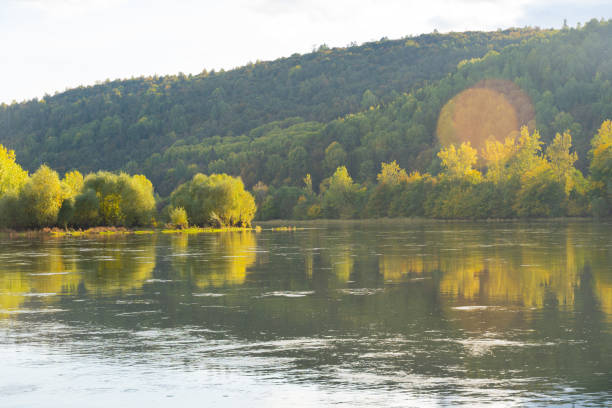 istock River in the mountains in autumn on a sunny warm day. 1272590946