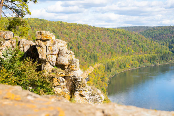 istock River in the mountains in autumn on a sunny warm day. 1272591173