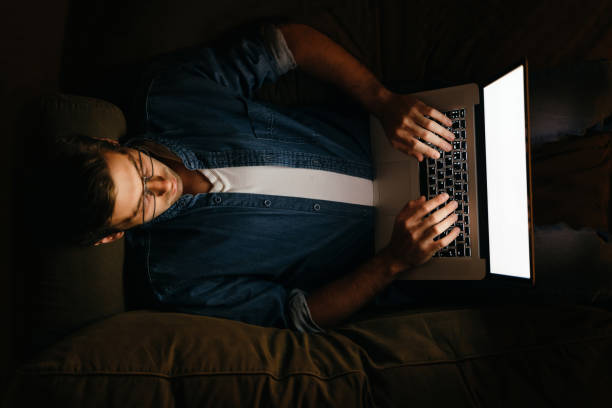 istock Man working on laptop late at night from home 1272591567