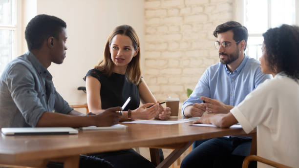 istock Multiracial colleagues talk brainstorm at office briefing 1272592637