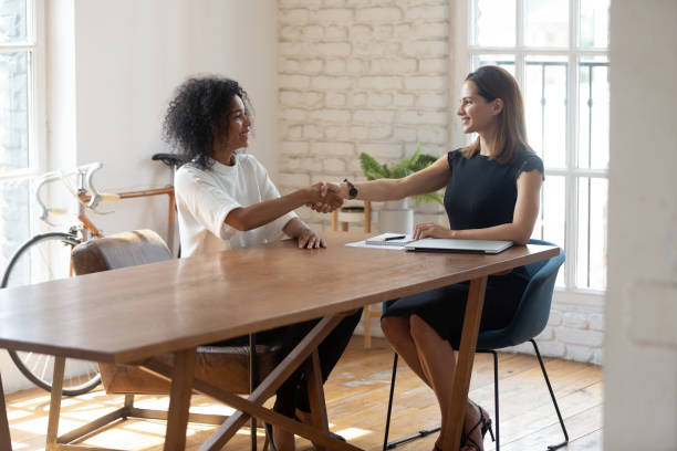 istock Happy CEO handshake greeting confident biracial employee at interview 1272592642