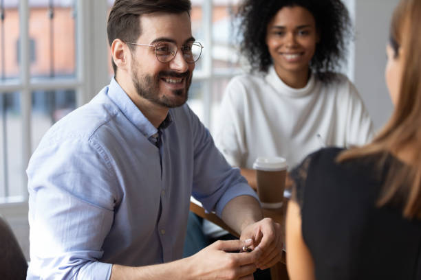 istock Smiling multiracial coworkers brainstorm at office briefing 1272592660