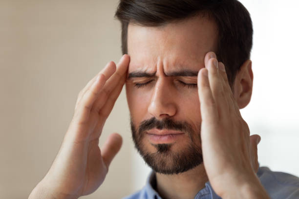 istock Tired male employee massage head suffering from headache 1272592677