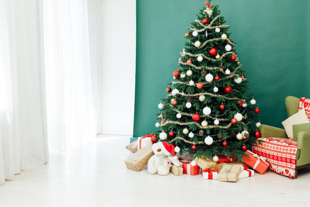 istock Rustic door opening into a room decorated for Christmas 1272592845