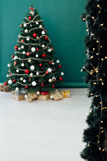 istock Rustic door opening into a room decorated for Christmas 1272592909