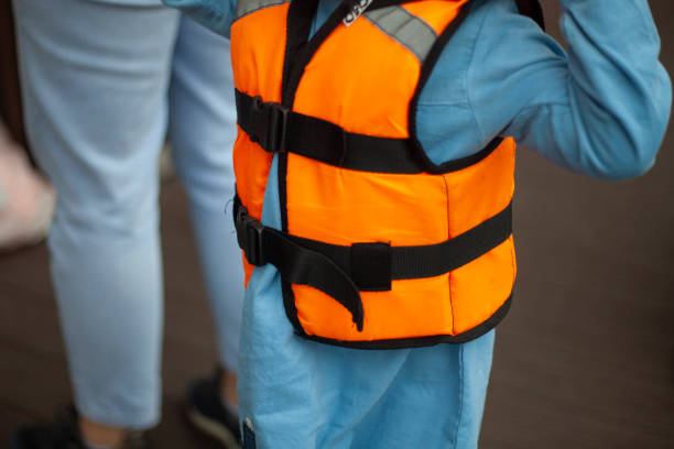 istock Life jacket on the child. Clothes for safe swimming. 1272593107