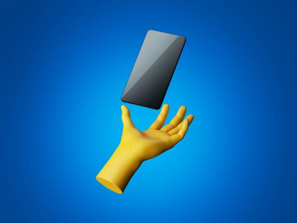 istock 3d render yellow hand holds black smartphone, digital device with glossy screen. Electronic gadget blank mockup isolated on blue background. Virtual reality, wireless technology concept 1272593134