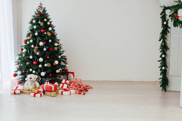 istock Decorated room with beautiful Christmas tree and gifts 1272593292