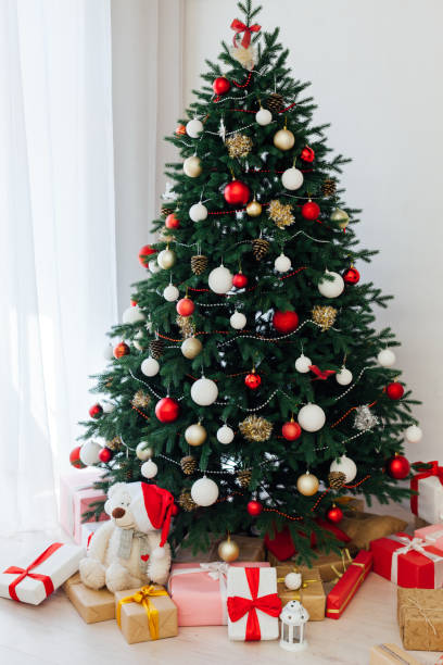 istock Decorated room with beautiful Christmas tree and gifts 1272593320