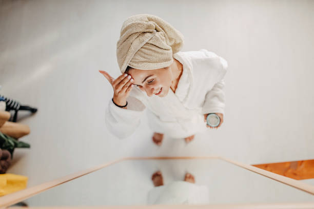istock Young girl applying face cream 1272596464