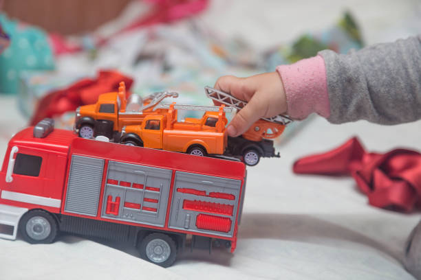 istock A child plays with cars that he just received as a gift 1272596993