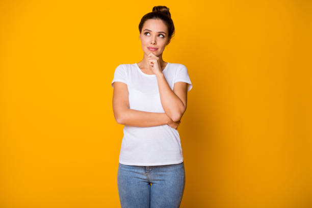 istock Portrait of interested girl look copyspace touch hands chin think thoughts decide decisions solution question answer wear modern clothes isolated over vivid color background 1272597936