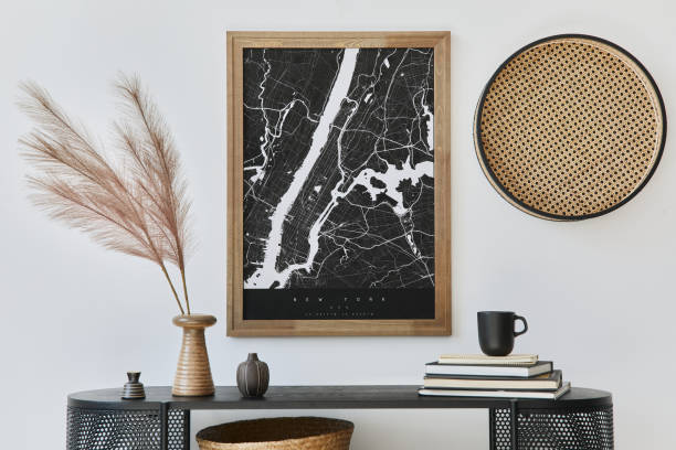 istock Modern scandinavian home interior with design wooden commode, mock up poster map, feather in vase, book and personal accessories in stylish home decor. Template. 1272599626