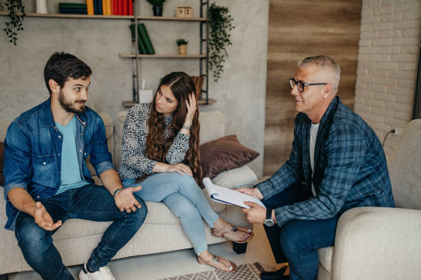 istock Young couple on a therapy session with a psychologist 1272599953