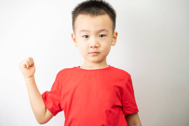 A little boy interested in fists