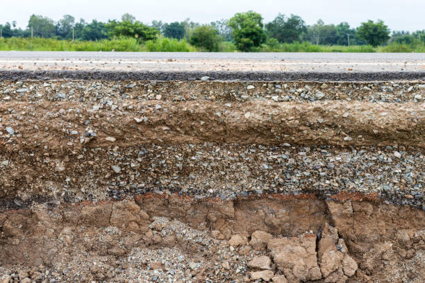 Rocky soil under the eroded road.