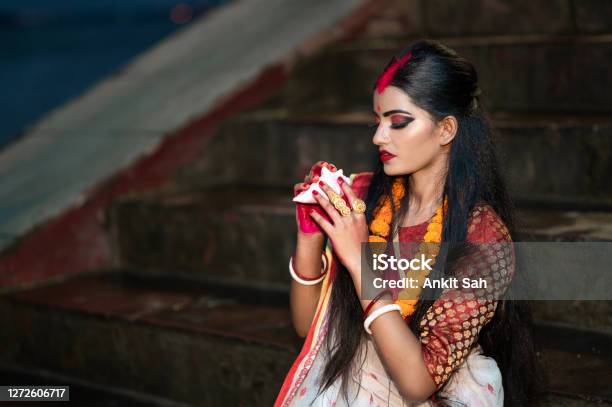 Traditional Bengali Woman Blowing Shankha Stock Photo - Download Image Now - Durga, Dussehra, Women