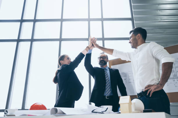 istock Group of business people engineer or architecture hands together celebrate success work, Team work and unity concept 1272608130