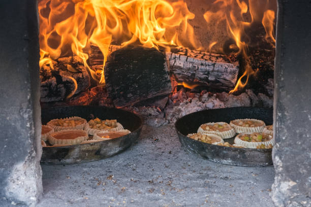 istock Burning birch wood in a traditional Russian oven. 1272610521