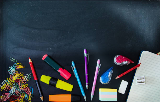istock Colorful school objects on a chalkboard 1272613750