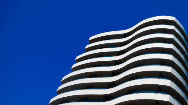 istock Modern panel building against the sky, flowing lines 1272614825