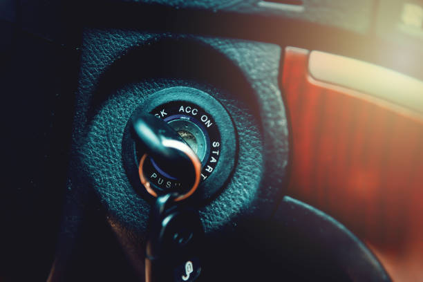 istock Close up view of a car key in ignition 1272614864