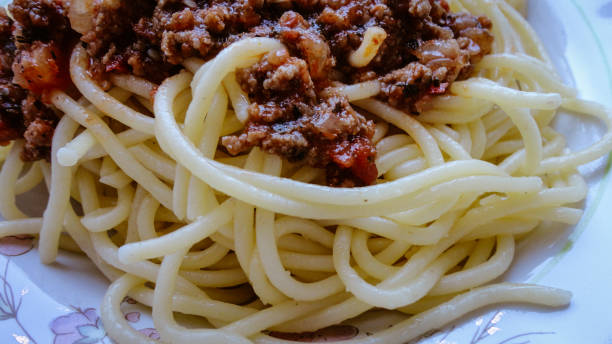 istock Spaghetti Bolognese with minced beef in the white plate 1272616193