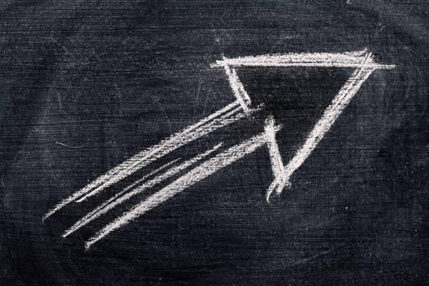 istock Arrow symbol, chalk on dirty blackboard 1272618681