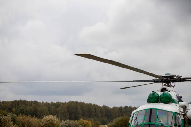 istock Helicopter blades against the sky with clouds 1272620167