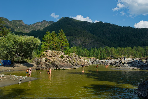 Ust-Sema. Russia. August 08, 2020. Residents of the Altai Mountains and numerous tourists relax and swim in one of the most favorite places on the Katun river - 