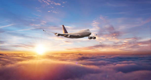 istock Huge commercial airplane flying above clouds. 1272621607