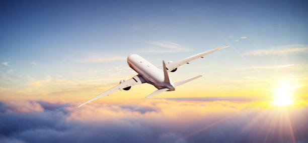 istock Huge commercial airplane flying above clouds. 1272621666