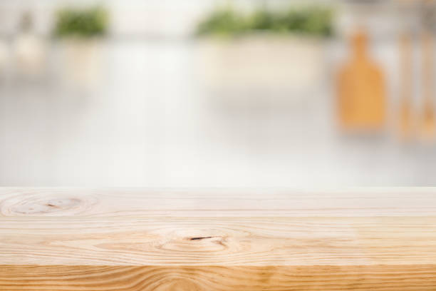 istock Wood table top on blur kitchen counter (room)background 1272622306