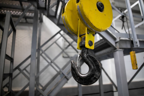 istock Swivel chain hook of electric hoist in workshop, chain block, pullers 1272622427