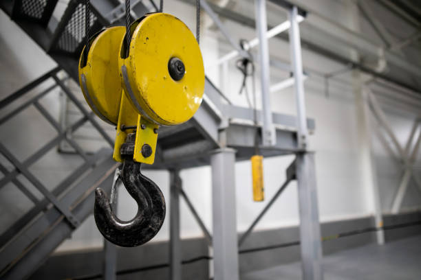 istock Swivel chain hook of electric hoist in workshop, chain block, pullers 1272622659