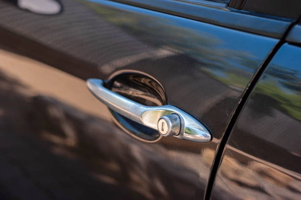 istock Generic car styled metal door handle close up shot daytime light 1272624407