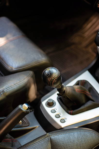 istock Car manual gear box housing and leaver inside vehicle top view generic 1272624417