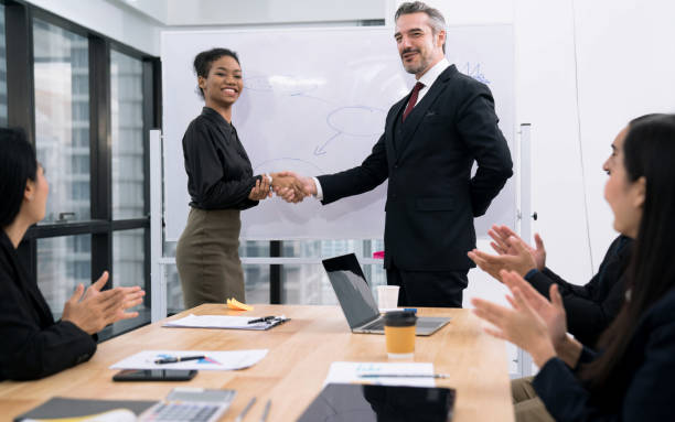 istock Professional Business Teamwork, Management congratulated the staff for their excellent work, Her colleagues welcomed and applauded for support. 1272625543