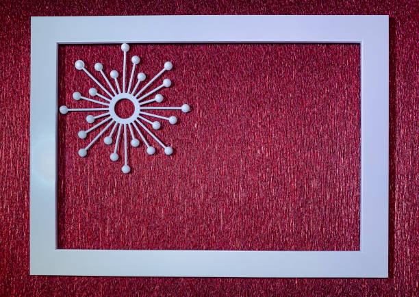 istock White photo frame and snowflake on a red corrugated background. Christmas background with photo frame 1272628008