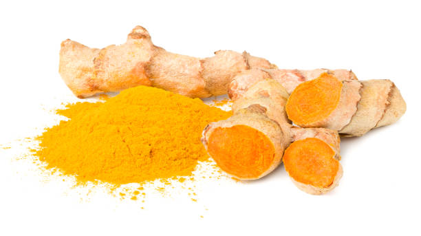 istock Turmeric powder with turmeric root isolated on white background 1272628132