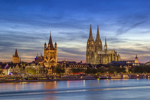 View of historical center of Cologne from Rhine river in evening, Germany