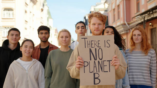 istock Multiracial activists protest supporting ecology and clean planet 1272630672