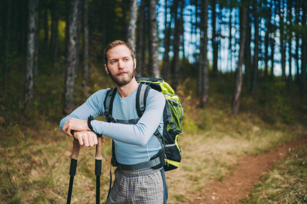 istock Tourist man hiking in the mountain 1272630828