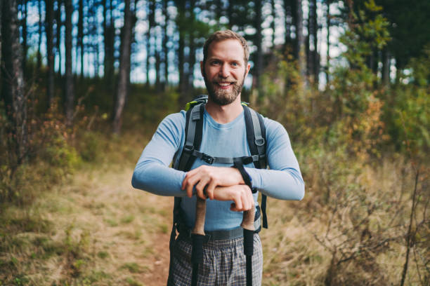 istock Tourist man hiking in the mountain 1272630892