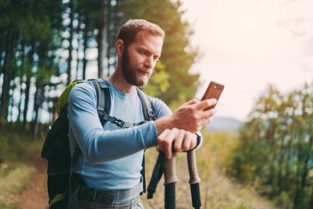 istock Tourist man hiking in the mountain 1272630971