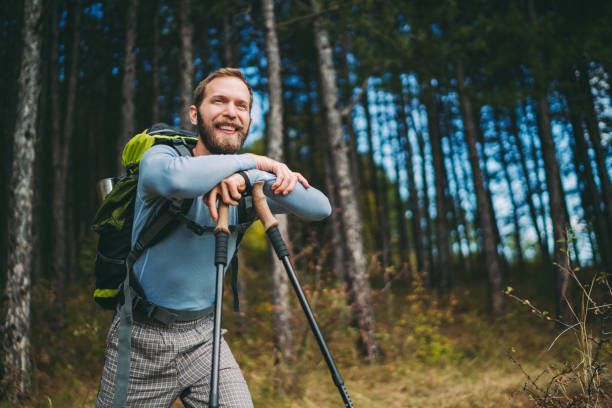 Tourist man hiking in the mountain