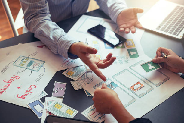 istock Designers planning to work together Draw application program in mobile phone and website development. 1272631059