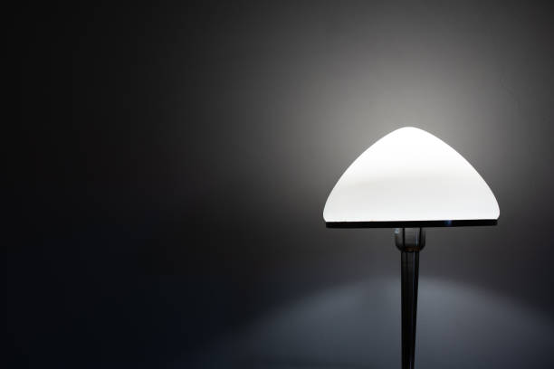 istock Bedside nightstand LED lamp isolated dark mood 1272632220
