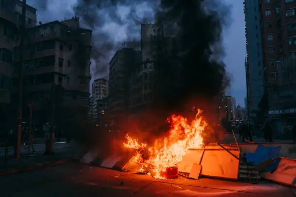 Burning street blockade in Hong Kong, China.