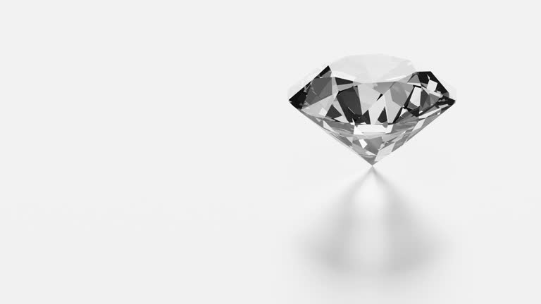 Diamond rotating on white background with copy space